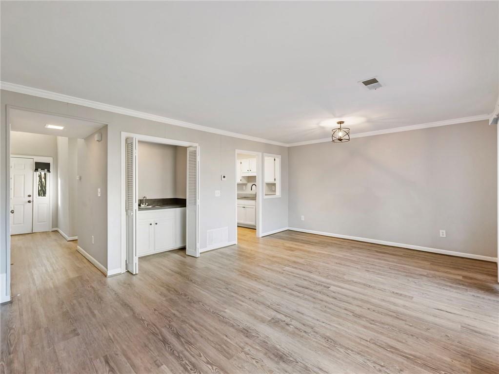 6500 Gaines Ferry Road, Unit A2 Flowery Branch, GA 30542 - Photo 12 of 42 a view of empty room with wooden floor