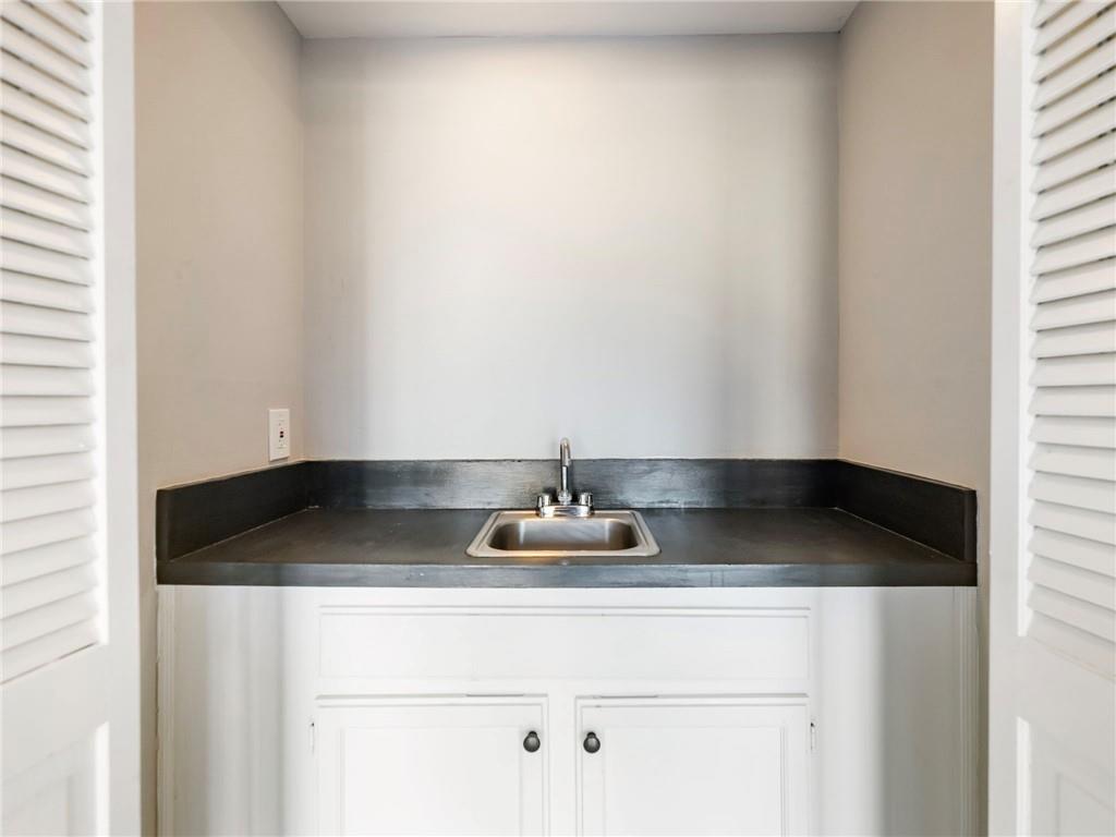 6500 Gaines Ferry Road, Unit A2 Flowery Branch, GA 30542 - Photo 14 of 42 a kitchen with a sink and cabinets