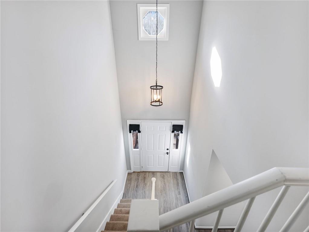 6500 Gaines Ferry Road, Unit A2 Flowery Branch, GA 30542 - Photo 18 of 42 a view of a hallway with wooden floor