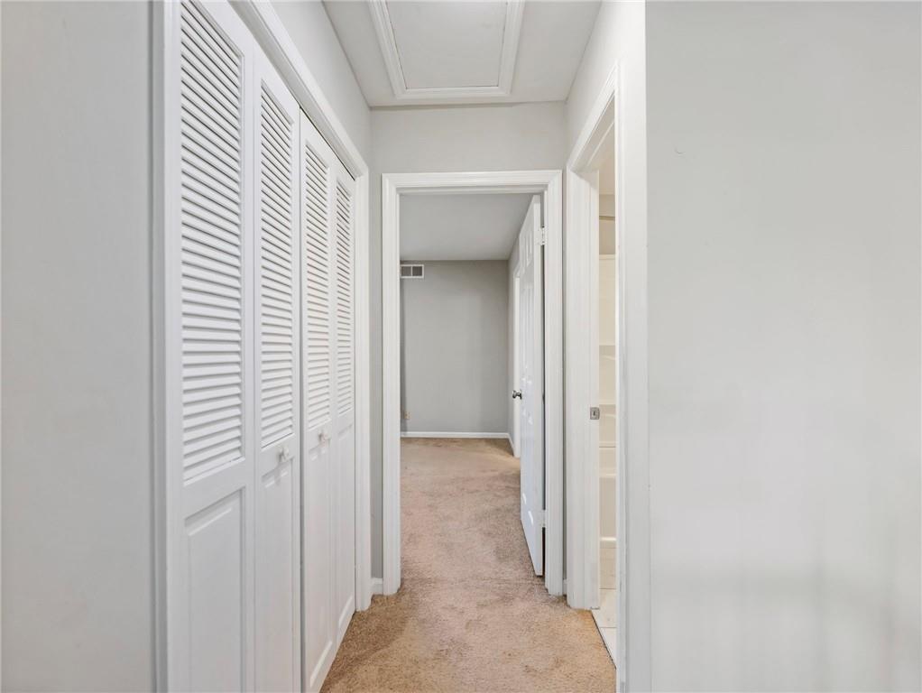 6500 Gaines Ferry Road, Unit A2 Flowery Branch, GA 30542 - Photo 19 of 42 a view of a hallway to rooms