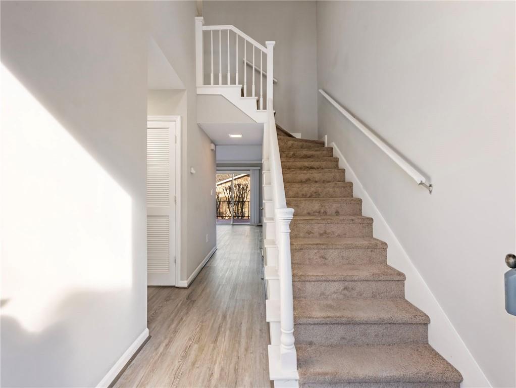 6500 Gaines Ferry Road, Unit A2 Flowery Branch, GA 30542 - Photo 2 of 42 a view of entryway with wooden floor