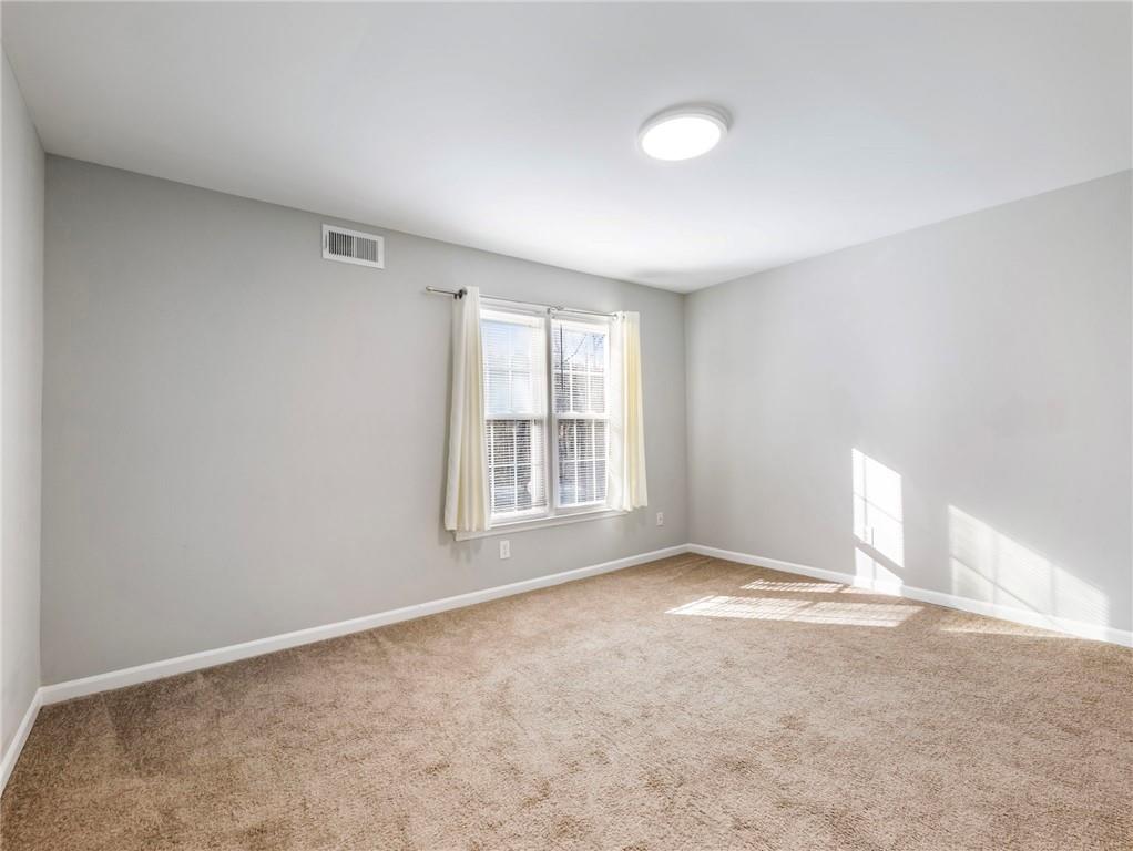 6500 Gaines Ferry Road, Unit A2 Flowery Branch, GA 30542 - Photo 21 of 42 a view of an empty room with a window