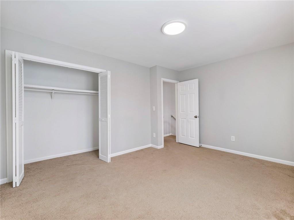 6500 Gaines Ferry Road, Unit A2 Flowery Branch, GA 30542 - Photo 22 of 42 an empty room with closet area