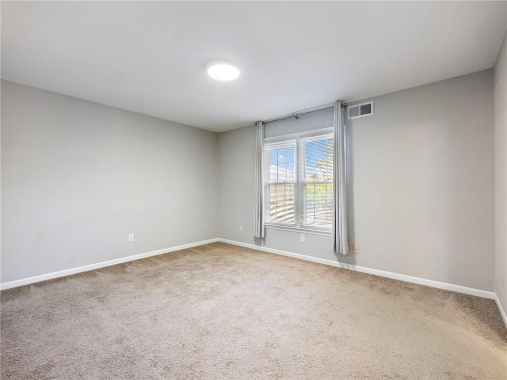 6500 Gaines Ferry Road, Unit A2 Flowery Branch, GA 30542 - Photo 23 of 42 a view of an empty room with a window