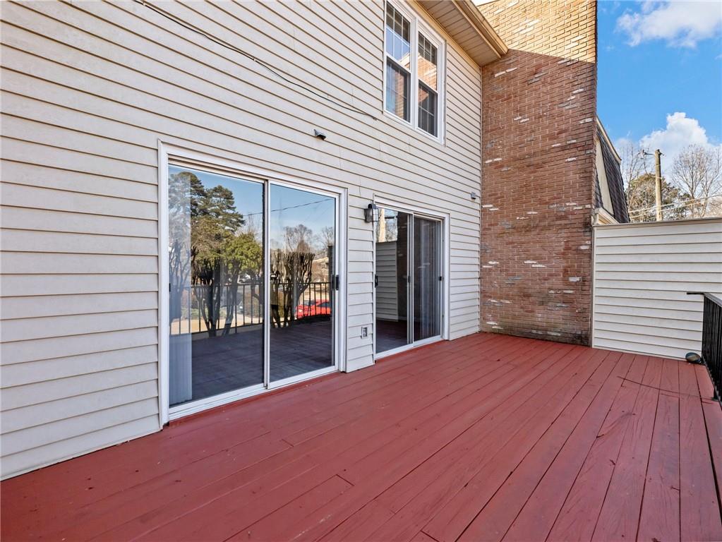 6500 Gaines Ferry Road, Unit A2 Flowery Branch, GA 30542 - Photo 29 of 42 a view of a house with backyard and wooden floor