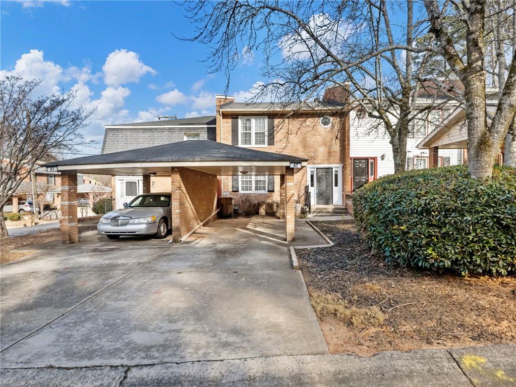 6500 Gaines Ferry Road, Unit A2 Flowery Branch, GA 30542 - Photo 31 of 42 a view of a car park in front of house