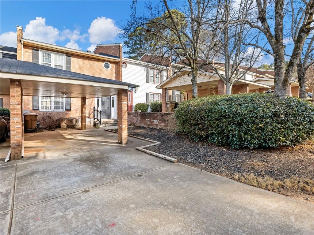 6500 Gaines Ferry Road, Unit A2 Flowery Branch, GA 30542 - Photo 32 of 42 a view of a building with a large trees