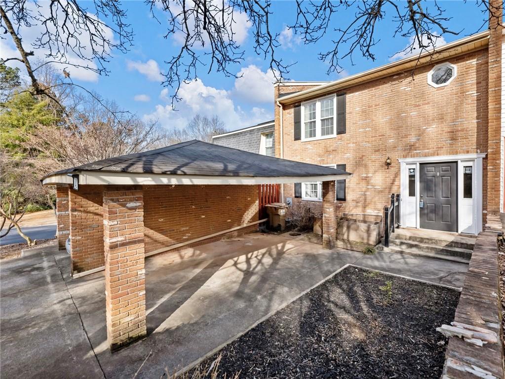 6500 Gaines Ferry Road, Unit A2 Flowery Branch, GA 30542 - Photo 33 of 42 a view of a house with a patio