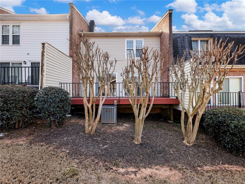 6500 Gaines Ferry Road, Unit A2 Flowery Branch, GA 30542 - Photo 34 of 42 a view of a house with backyard and porch