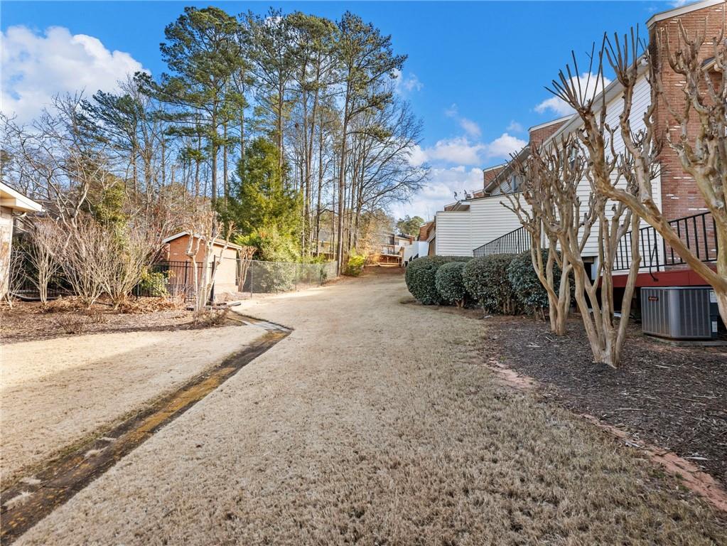 6500 Gaines Ferry Road, Unit A2 Flowery Branch, GA 30542 - Photo 35 of 42 a view of a yard with snow on the road