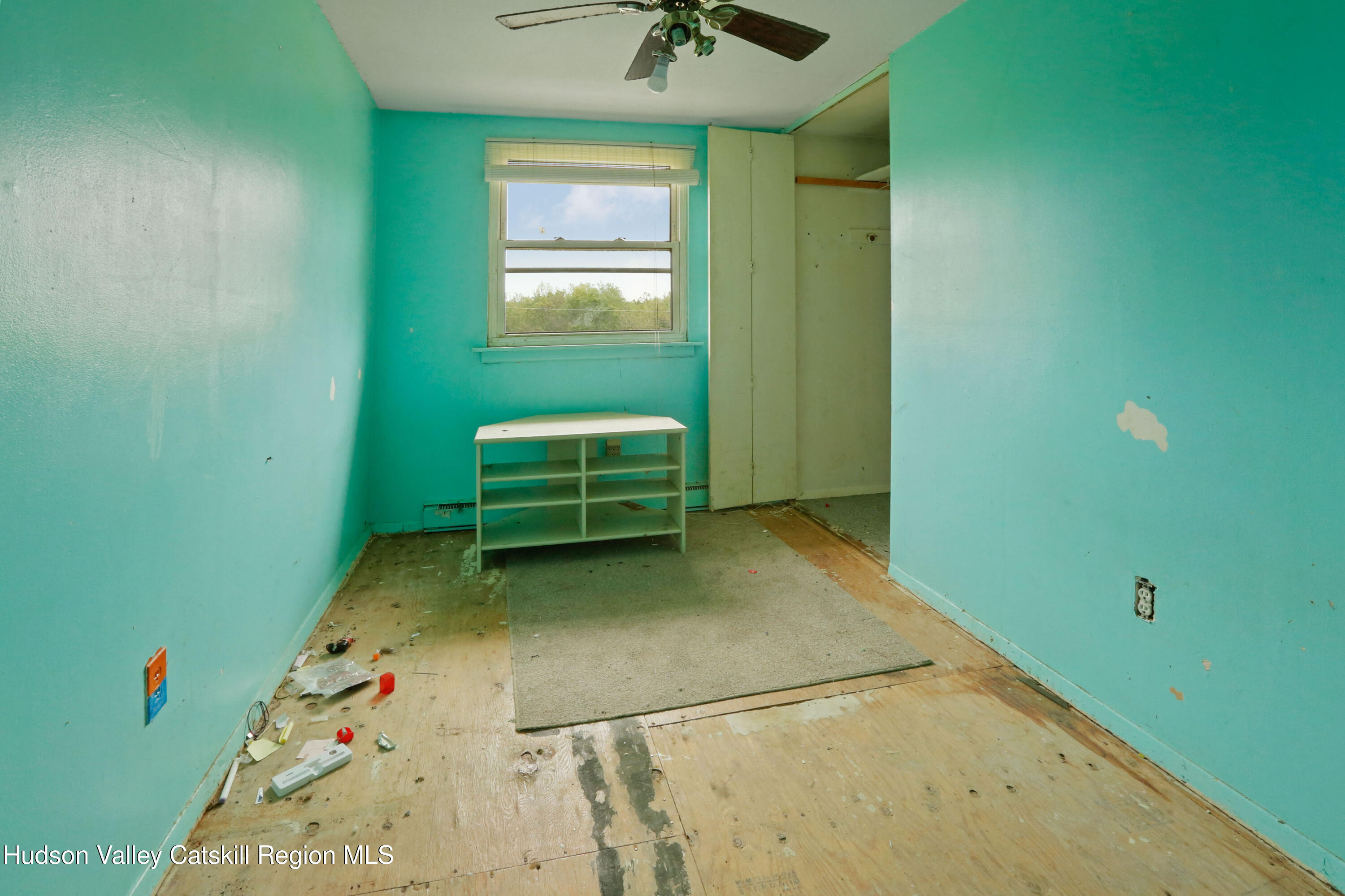 881 Albany Post Road, Unit 5 New Paltz, NY 12561 - Photo 13 of 16 a room with a window and a ceiling fan