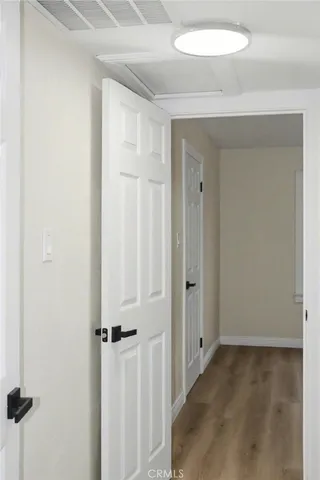 a view of a hallway with a shower