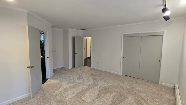 a bathroom with a toilet a sink and window