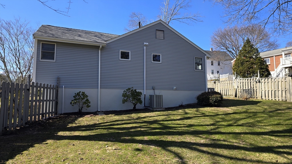 91 Mary Ellen Road Newton, MA 02468 - Photo 7 of 32 a front view of a house with a yard