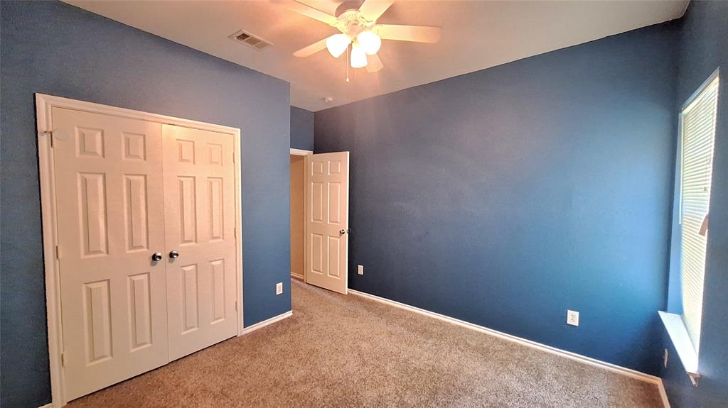 953 Hannah Way Dallas, TX 75253 - Photo 6 of 22 Carpeted room featuring a ceiling fan with light fixture, window with blinds, and white trim