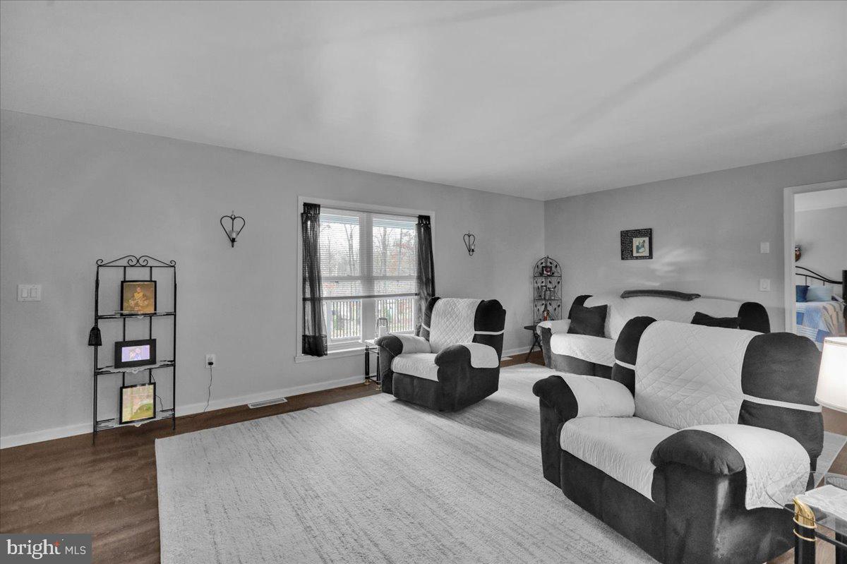 119 Smoketown Road Mertztown, PA 19539 - Photo 15 of 40 a living room with furniture and wooden floor