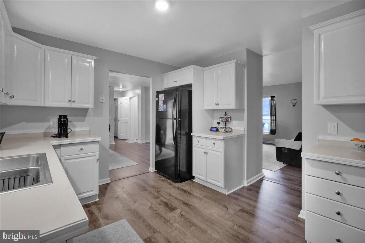 119 Smoketown Road Mertztown, PA 19539 - Photo 20 of 40 a kitchen with white cabinets and stainless steel appliances