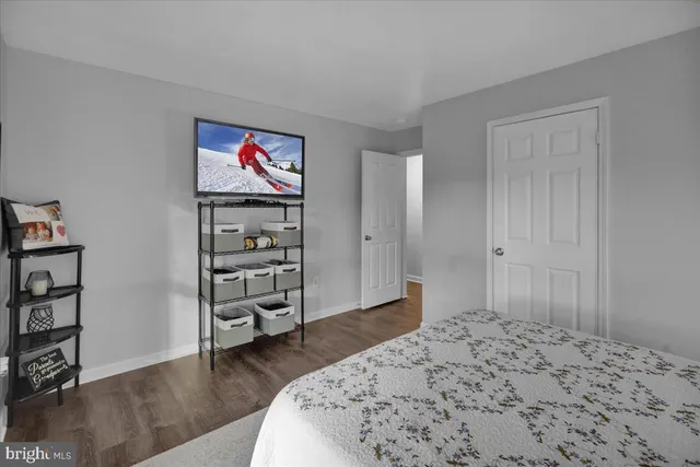 a bedroom with a bed and a book shelf