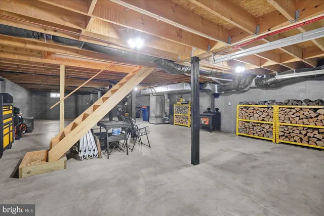 a view of an empty room with wooden shelves