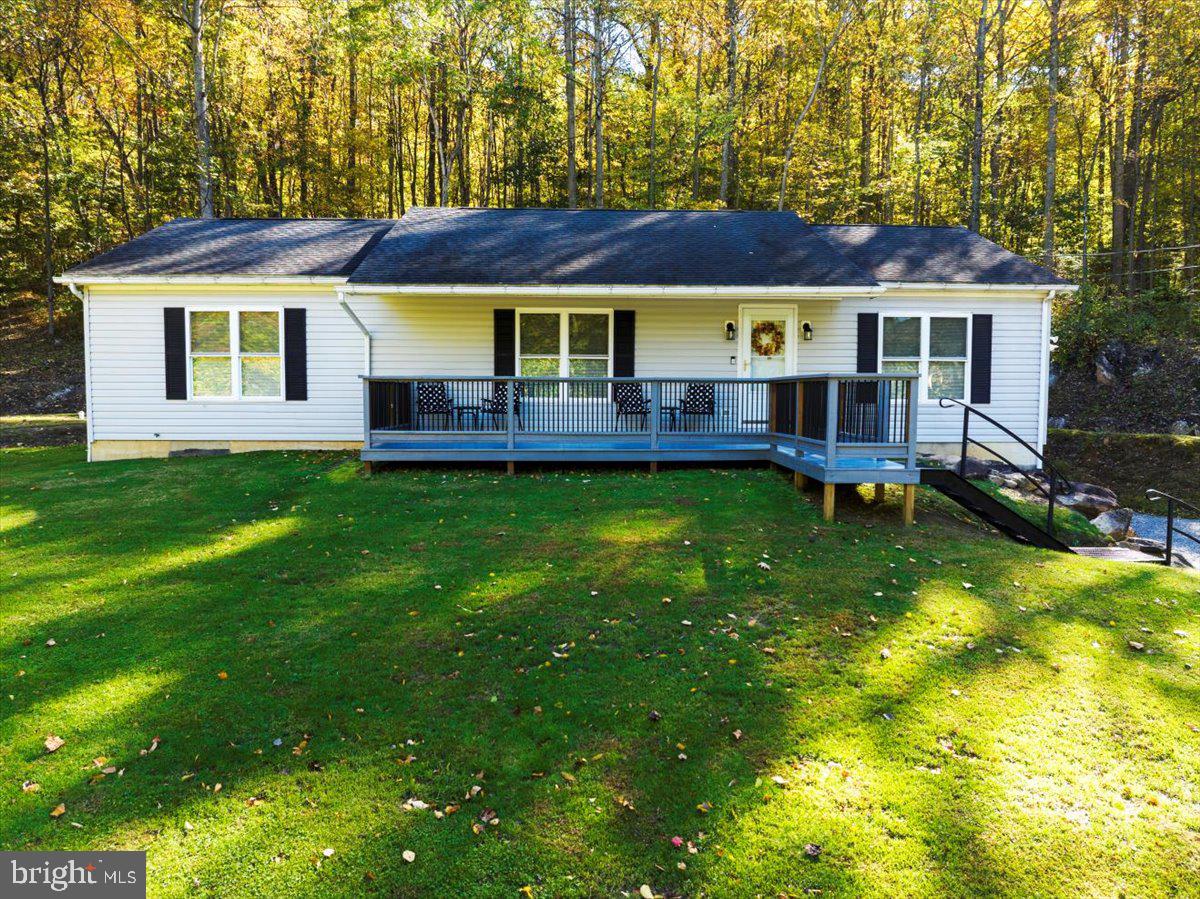 119 Smoketown Road Mertztown, PA 19539 - Photo 36 of 40 a view of a house with a backyard and a patio
