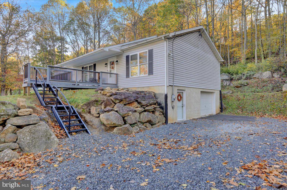 119 Smoketown Road Mertztown, PA 19539 - Photo 4 of 40 a view of a house with a yard next to a road
