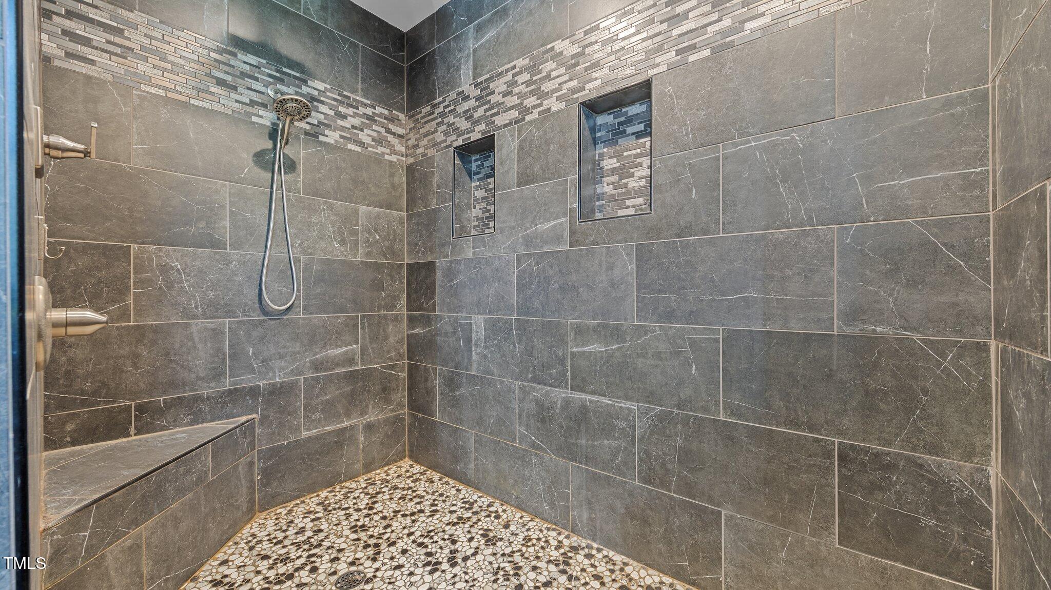 4152 Boyd Wright Road Burlington, NC 27215 - Photo 52 of 65 Huge tile shower with seat and 2 niche. Detachable shower head and rain head shower head.