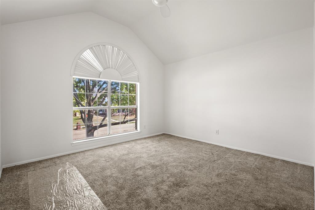 9502 Heartstone Lane Rowlett, TX 75087 - Photo 19 of 22 an empty room with a window