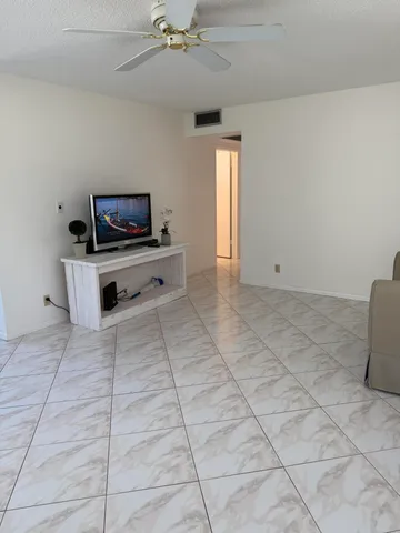 a view of living room with furniture and flat screen tv