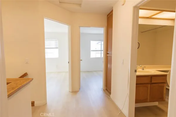 a view of a bathroom from a hallway
