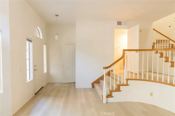a view of entryway with wooden floor