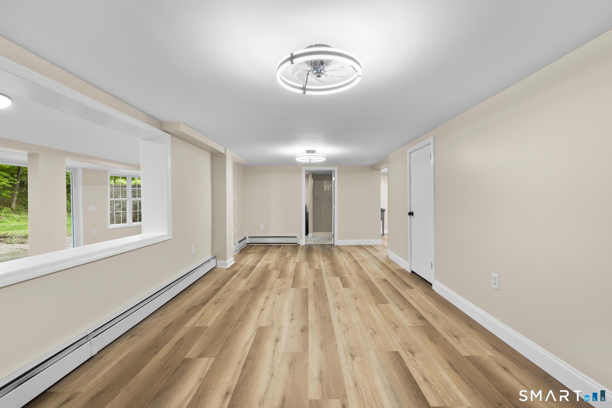 7 Sycamore Terrace Windham, CT 06280 - Photo 31 of 40 a view of empty room with wooden floor and fan