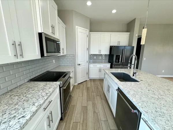 a view of gallery with wooden floor