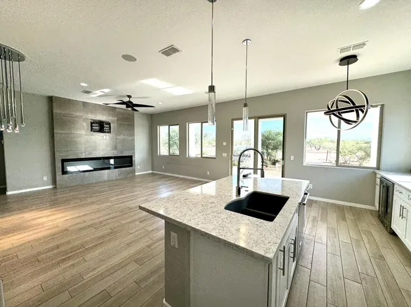 a kitchen with a sink a counter space and stainless steel appliances