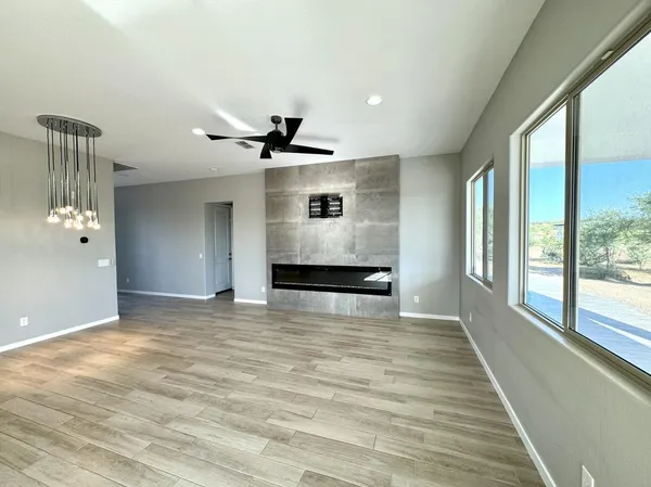 a large kitchen with lots of counter space a sink and a large window