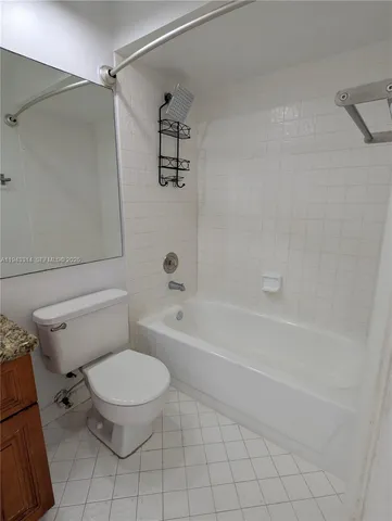 en empty room with window and a ceiling fan