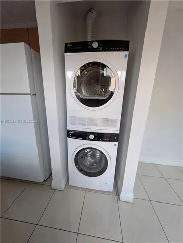 a kitchen with granite countertop a stove and a microwave