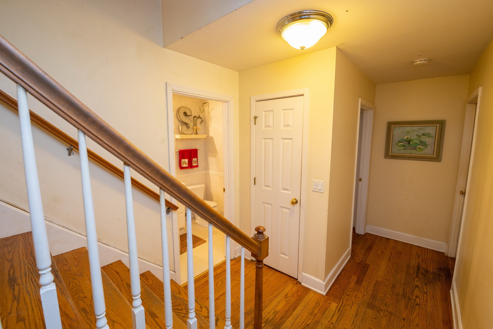 35W657 Park Lane St. Charles, IL 60175 - Photo 35 of 66 a view of a hallway with wooden floor and staircase