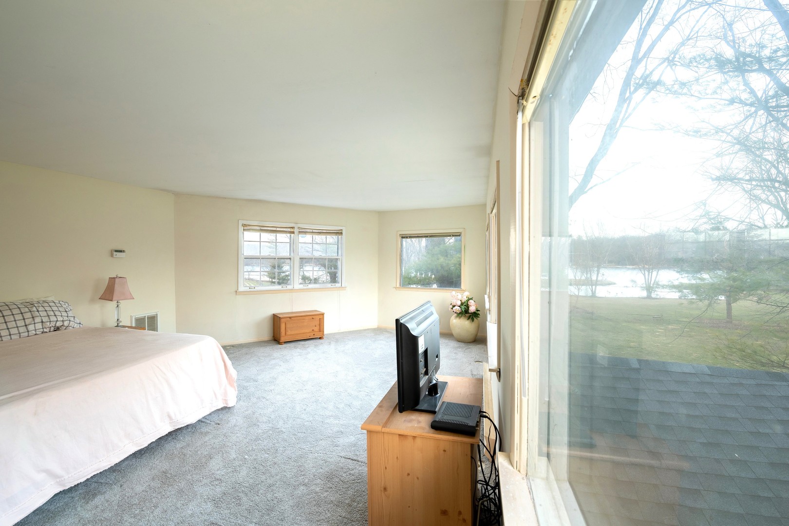 35W657 Park Lane St. Charles, IL 60175 - Photo 49 of 66 a bedroom with a bed and glass door