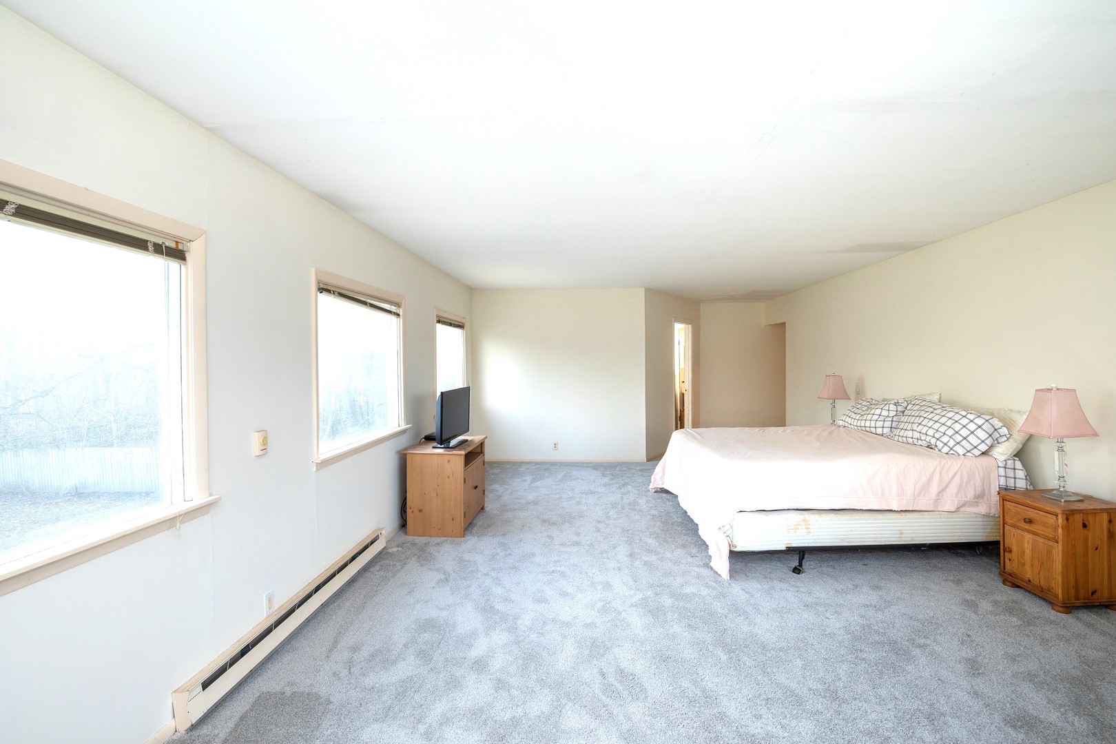 35W657 Park Lane St. Charles, IL 60175 - Photo 51 of 66 a spacious bedroom with a bed and a large window