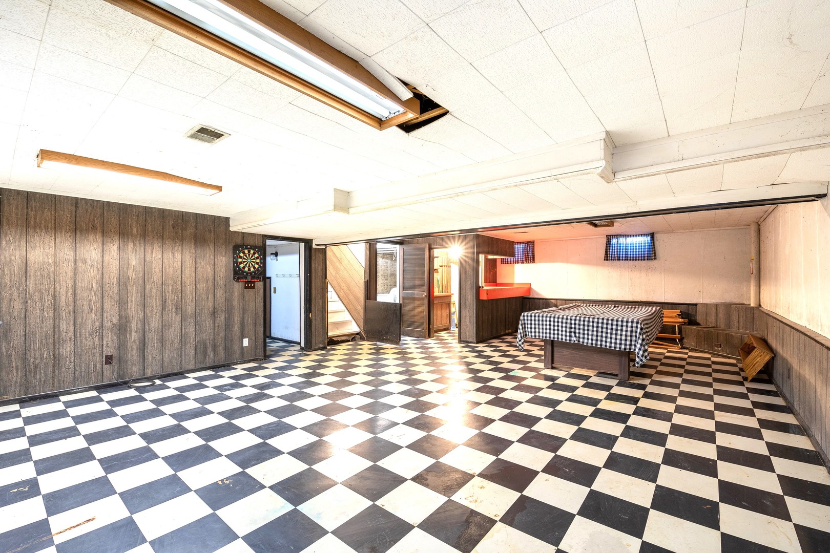 35W657 Park Lane St. Charles, IL 60175 - Photo 59 of 66 a room with a black white checkered floor with a black white checkered floor