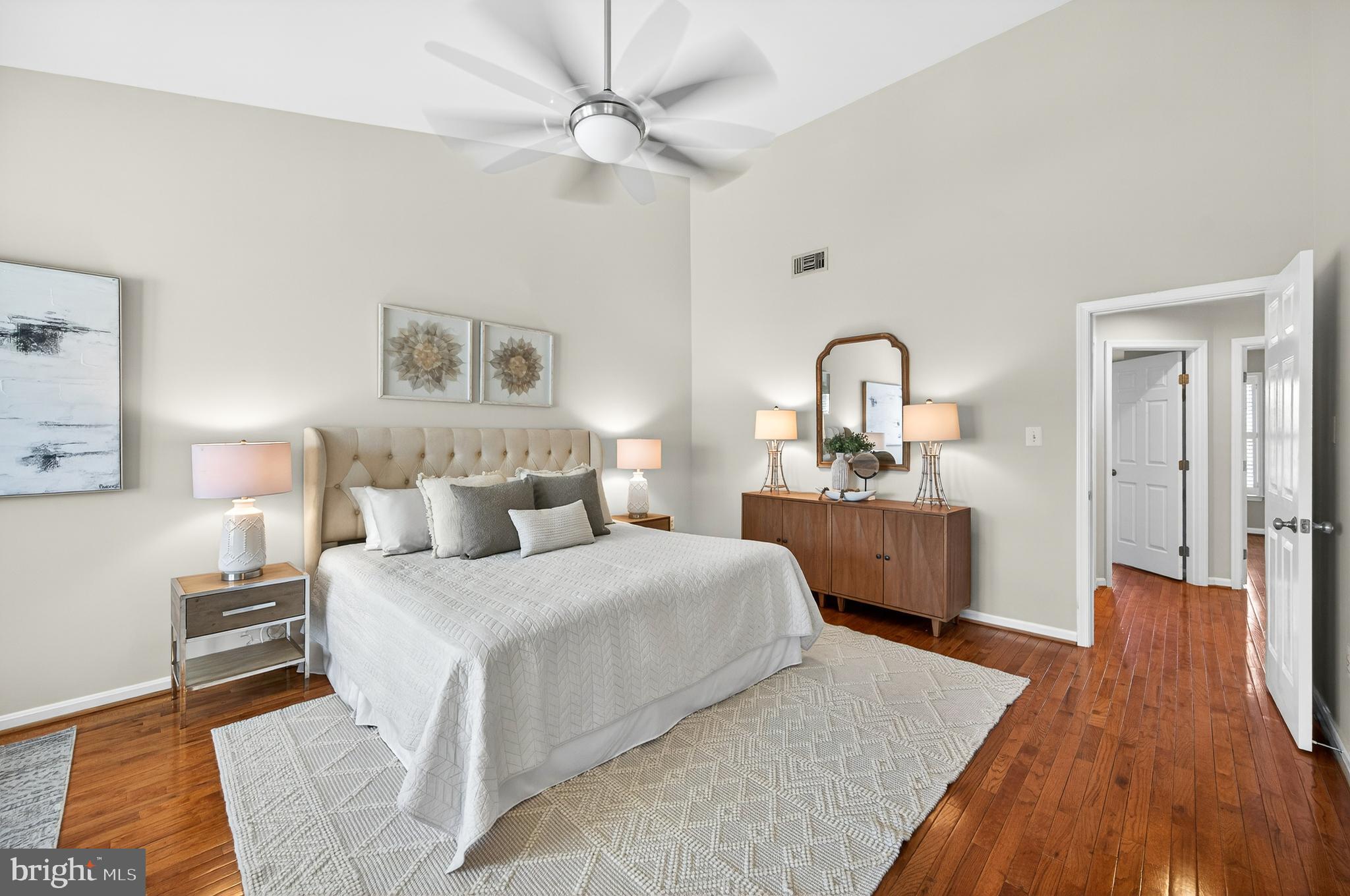 2143 Wolftrap Court Vienna, VA 22182 - Photo 25 of 49 a bedroom with a large bed and a chandelier