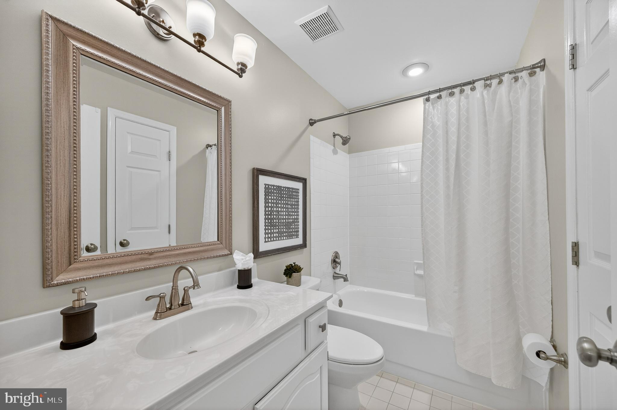 2143 Wolftrap Court Vienna, VA 22182 - Photo 33 of 49 a bathroom with a sink a toilet and shower