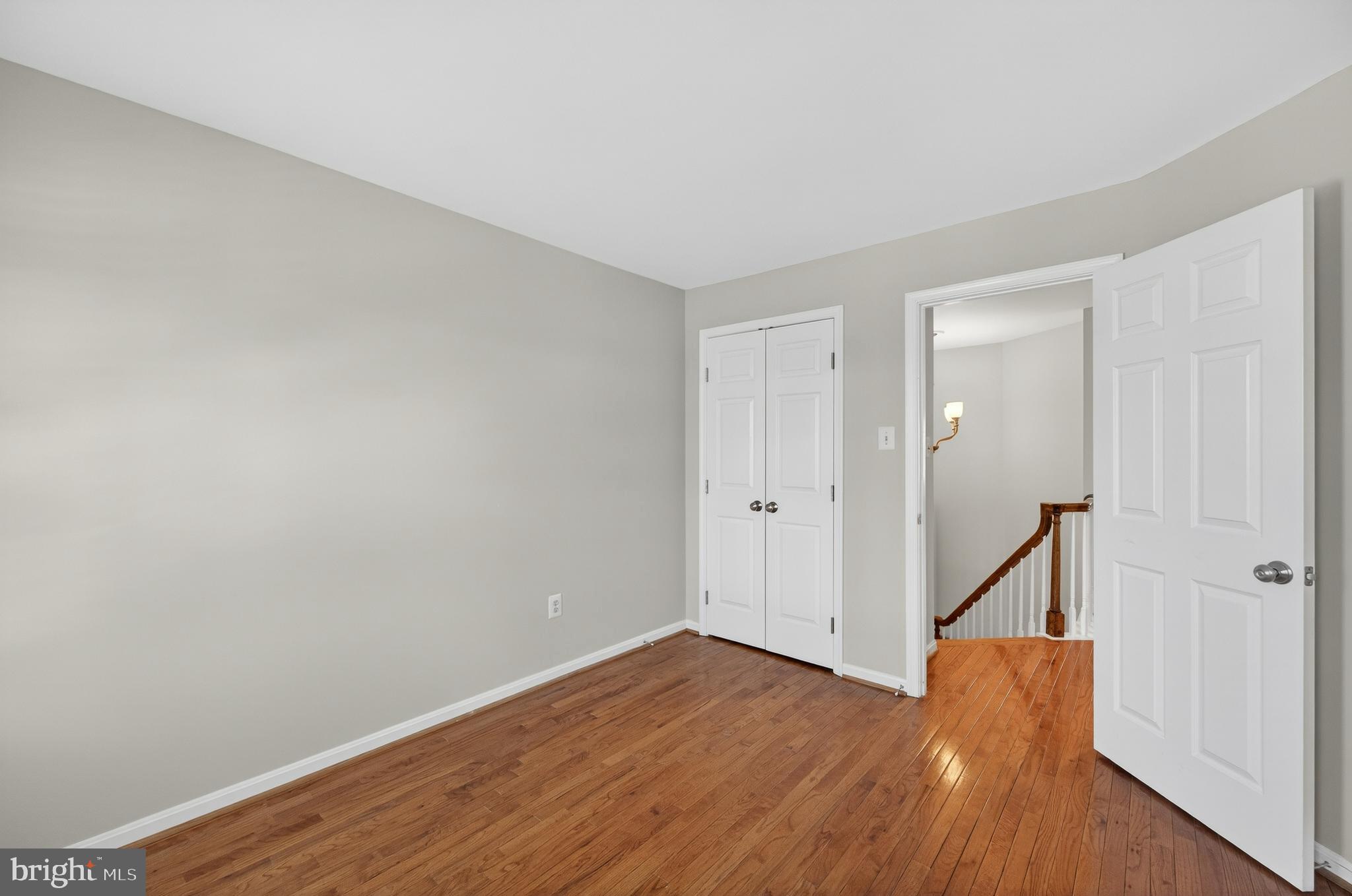 2143 Wolftrap Court Vienna, VA 22182 - Photo 36 of 49 a view of an empty room with wooden floor and a window