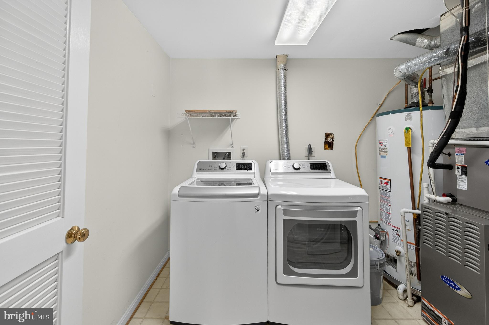 2143 Wolftrap Court Vienna, VA 22182 - Photo 43 of 49 a utility room with dryer and washer