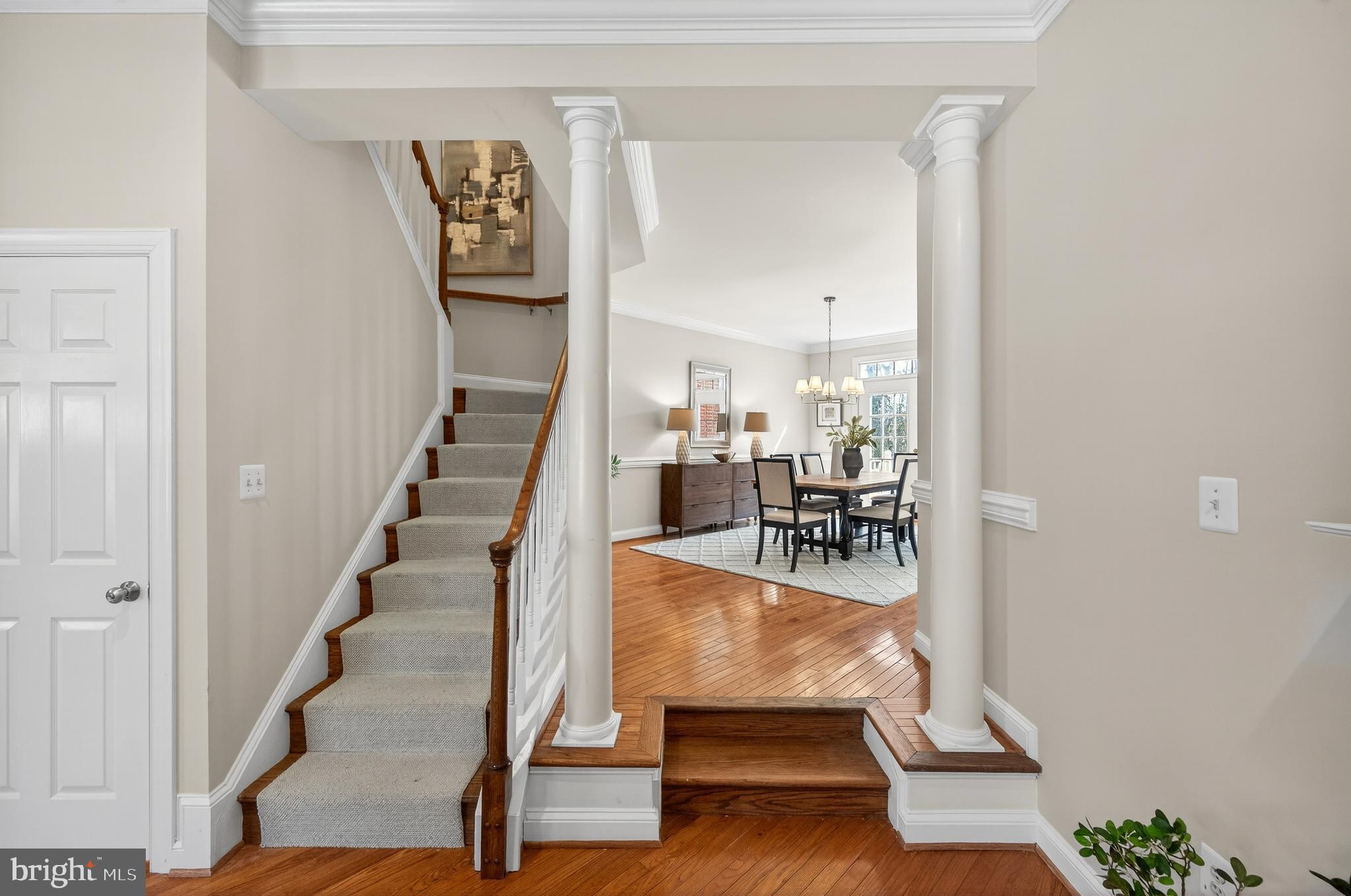 2143 Wolftrap Court Vienna, VA 22182 - Photo 10 of 49 a view of staircase with a rug and a chandelier