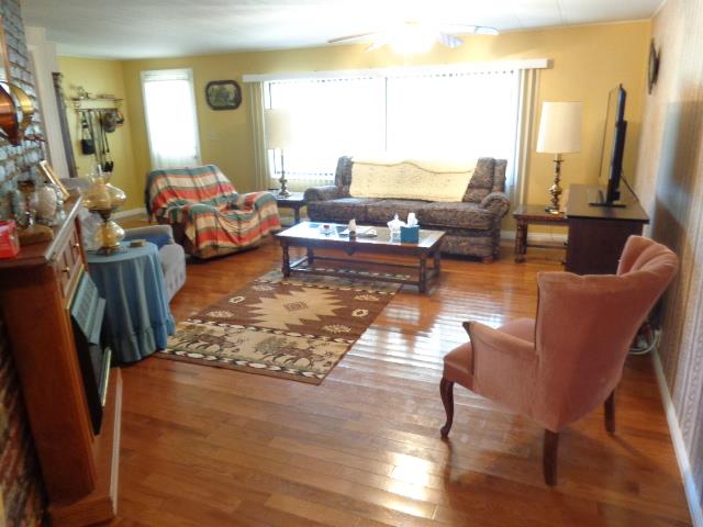 1709 Waverly Road Tennessee Ridge, TN 37178 - Photo 14 of 30 Living room with propane logs and yes thats real 3/4 inch real hardwood