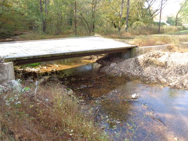 1709 Waverly Road Tennessee Ridge, TN 37178 - Photo 3 of 30 Bridge going over creek. Large propane truck has traveled bridge. Creek has some pools 4-5 ft deep to cool off on the sweltering humid days. Walk out of your home and instant pool with out the work.