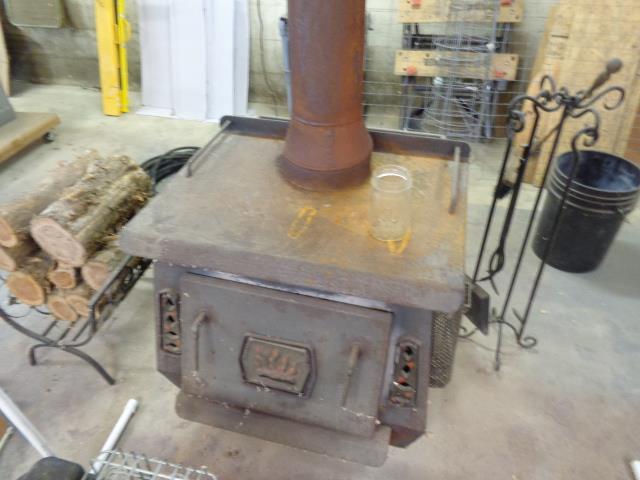 1709 Waverly Road Tennessee Ridge, TN 37178 - Photo 9 of 30 wood stove in the garage.... remain TOASTY THIS WINTER