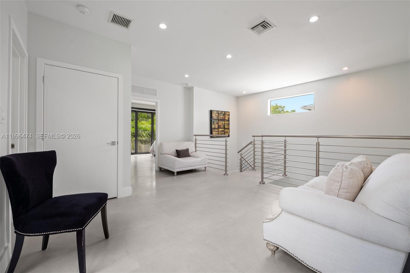 5735 Southwest 35th Street Miami, FL 33155 - Photo 12 of 30 a living room with furniture and a couch