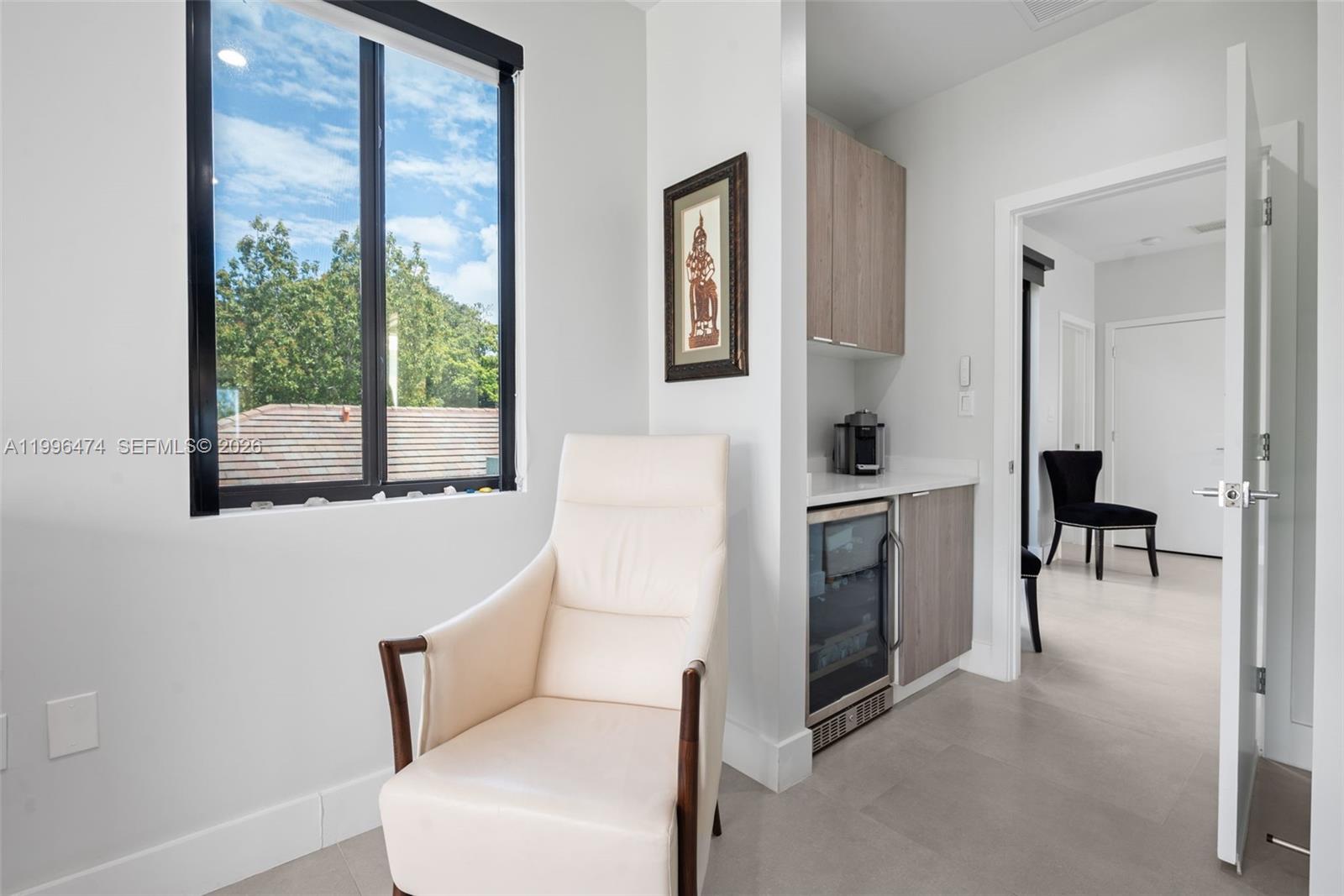 5735 Southwest 35th Street Miami, FL 33155 - Photo 14 of 30 a living room with furniture a fireplace and a large window